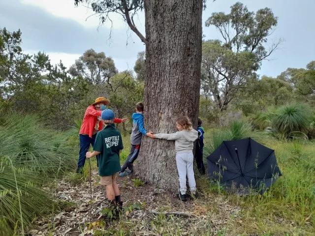 Children visiting the ‘Hug tree’.